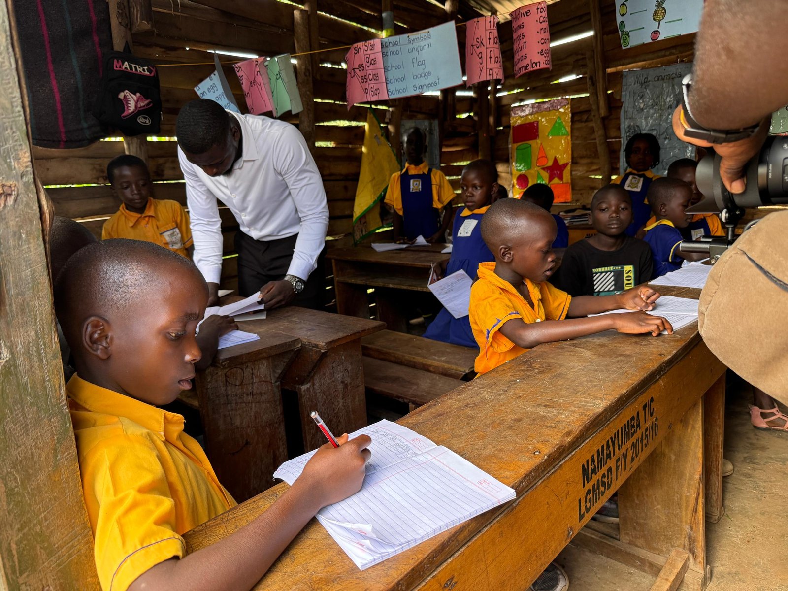 Children learning in a bright classroom at Lwamata Central Primary School